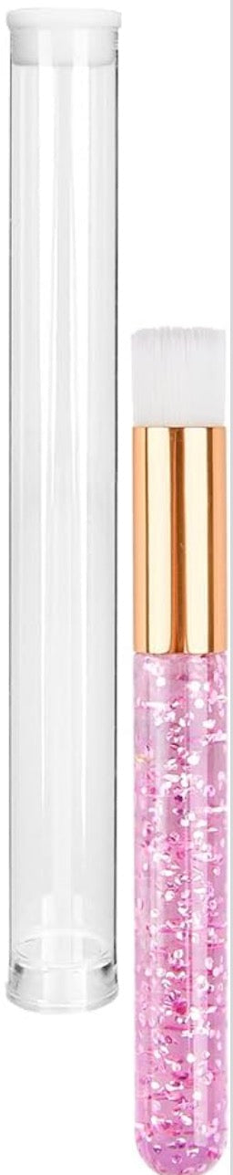 Clear cover tube and pink glittery brush.